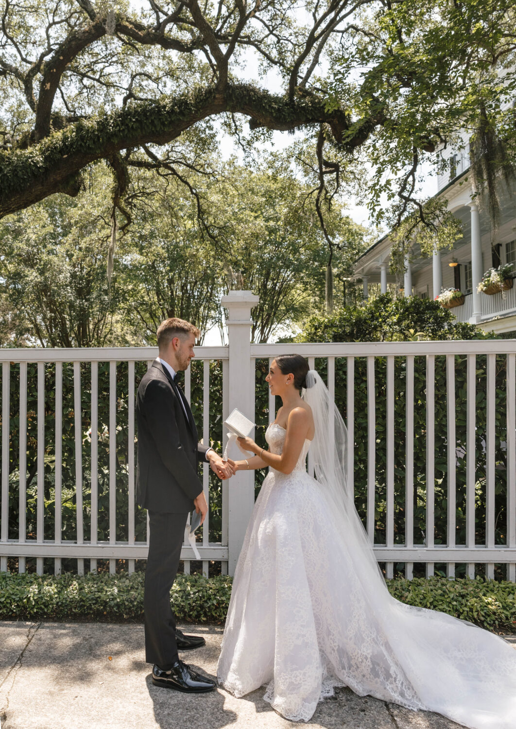 bride and groom share private wedding vows under shade of tree