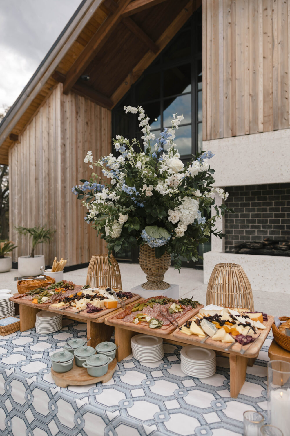 outdoor cocktail hour grazing board on the riverbank at The Dunlin wedding venue
