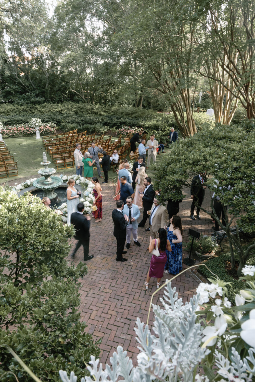 guests walk around at cocktail house and wait in line at the bar