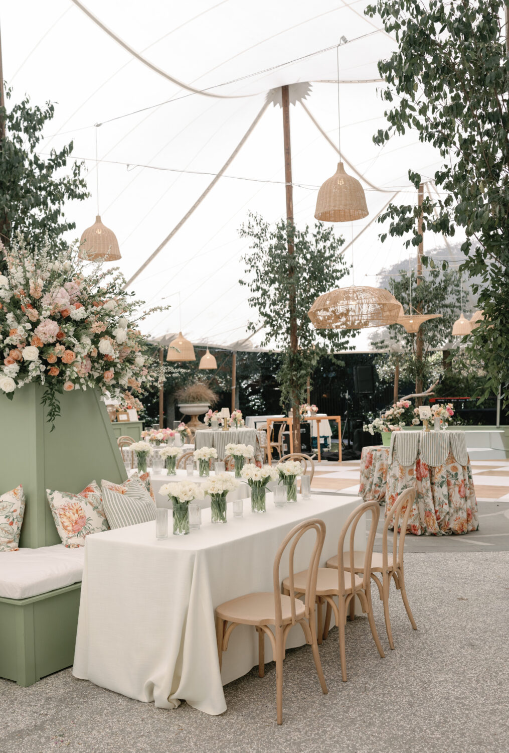 Spring colored wedding reception of tables, linens, and chairs